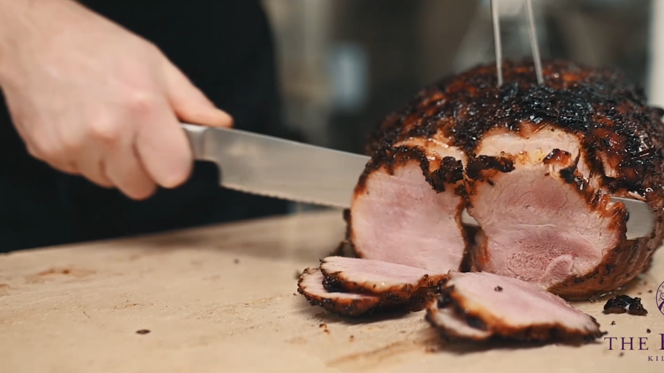 chef cutting cooked meat